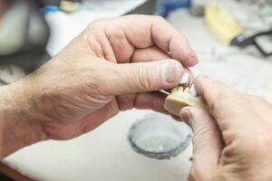 Dentist placing a dental crown on a patient in Leduc at Orchard Family Dental