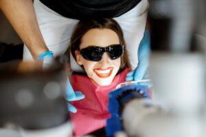 Patient smiling after professional teeth whitening treatment at Orchard Family Dental in Leduc